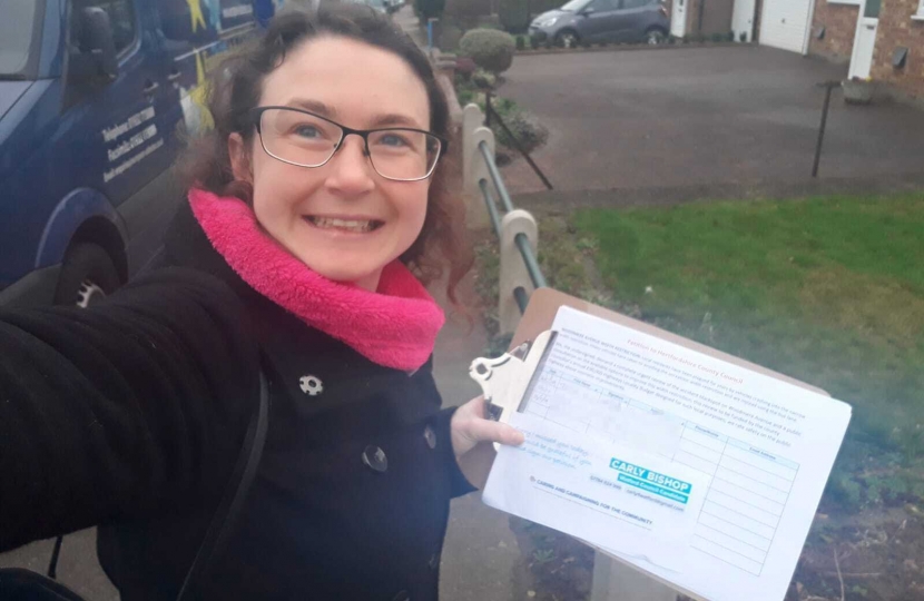 Carly knocking on doors with the Woodmere Avenue width restriction petition