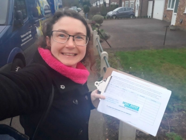 Carly knocking on doors with the Woodmere Avenue width restriction petition